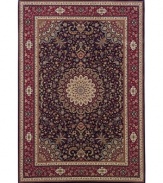 A beautiful example of an ancient Persian ardebil carpet, this rug features a medallion design ringed with tiny flowers. A deep navy ground exquisitely offsets the springlike palette of yellows, blues, greens and purples.