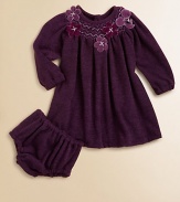 Plush, long-sleeve style with a smocked neckline and pretty flowers for an extra special touch. Round neckSmocked necklineLong sleeves with elastic cuffsButton back92% polyester/8% spandexHand wash or dry cleanImported