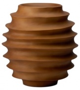 Smooth grooves. The round Rippled vase from Donna Karan Lenox embodies the luxe sophistication of New York in mango wood that's hand-sculpted, carved and finished by master artisans to make a distinctly beautiful statement.