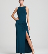 This formfitting Akiko maxi dress flaunts a ruched side slit for a tasteful hint of skin.
