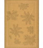 One with nature. This flat-weave indoor/outdoor area rug from Safavieh comes alive with a natural fern frond motif that adds a lush, leafy allure to the rich, golden ground.