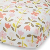Bright blossoms in pink, peach and coral with green and grey leaves on a white background. The American Academy of Pediatrics and the U.S. Consumer Product Safety Commission have made recommendations for safe bedding practices for babies. When putting infants under 12 months to sleep, remove pillows, quilts, comforters, and other soft items from the crib.