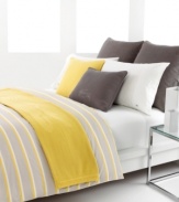 Morning sunshine. Inspired by purity and simplicity, the Dellen duvet cover set from Lacoste awakens your room with crisp stripes of citron and gray in soft cotton. Hidden button closure; reverses to self.