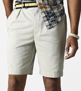 Classic fitting shorts in washed cotton tissue chino. Standard-rise belted waist. Zip fly with button closure. Double-forward pleats, generous straight leg. Side seam pockets, button back welt pocket.