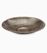 Recycled metal becomes a thing of beauty in the practiced hands of Haiti's esteemed Croix-des-Bouquets artisans. Carefully cut, hammered and varnished, this radiant Leaf bowl serves to hold jewelry, display whole fruit and accent coffee tables. A meaningful gift.