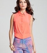 Break out of the tee zone and opt for this silk Nanette Lepore top, designed with buttons through the front and flaunting a luscious summer hue. Imbuing your look with flavorful style, the silhouette teams with colorful prints for a punchy, trend-right finish.