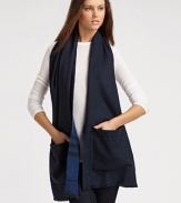 A wool, check design with baby fringe that features a solid side with functional pockets. WoolAbout 20 X 71Dry cleanImported 