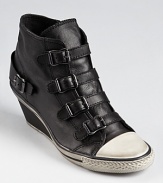 A modern fusion from Ash, featuring dramatic buckles down the vamp and a distressed rubber sole.