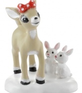 All kinds of cute. A doe-eyed deer fawns over Rudolph while two white rabbits vie for her attention in this porcelain figurine from North Pole Village, by Department 56.