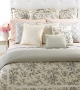 A detailed toile print of cherry blossoms and branches cascades over a sumptuous cream ground in the Saint Honore comforter. Streamlined piping and a frame of grosgrain ribbon finishes this traditional look with a touch of modern romance. Reverses to a subtle houndstooth print for an impressive transformation in style.