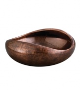 Add allure and sophistication to any event with Nambe serveware and serving dishes. Crafted of alloy and finished in beautiful bronze, this Heritage pebble bowl from Nambe combines old-world elegance with a balanced, modern shape for easy serving in style.