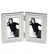 Add new elegance to beautiful memories with Vera Wang's With Love Blanc folding picture frame. Geometric detail lends metallic shimmer to creamy white enamel in a home accent that invokes modern and deco design.