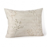 A soothing, natural print infuses your home with modern elegance. Delicate dawn-colored branches bedecked with olive and blue leaves adorn this peaceful Calvin Klein Home sham.