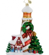 The season's best and brightest. Christopher Radko's Holiday Beacon ornament shines at Christmases by the sea, featuring a lighthouse decorated with ribbon and a wreath, plus a quaint holiday cottage.