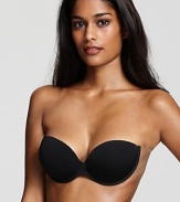 A strapless and backless underwire bra with adhesive tape at sides for a supportive fit.