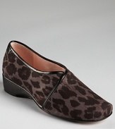 Taryn Rose's Kelsey wedges get a roaring update in leopard print fabric, equipped with a subtle one-inch wedge.