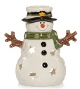 Filled with good cheer, this snowman luminary from Yankee Candle features a pure white glaze and delicate pierced stars. Sparkling Cinnamon tealights suffuse your home with the smell of Christmas.
