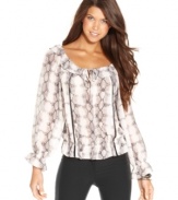 XOXO gives the traditional peasant shirt a lift with a playful snakeskin print, a ruffled collar and an adorable peplum hem! Pair it with trousers or your favorite denim for an effortlessly pretty look!