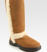 This suede style looks and feels comfortable with shearling lining, padded insole and outside trim. Heel, 1 (25mm) Shaft, 11 Leg circumference, 14 Logo at heel Shearling lining and padded insole Rubber sole ImportedOUR FIT MODEL RECOMMENDS ordering true whole size; ½ sizes should order the next whole size down.