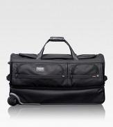 This roomy wheeled duffel is ideal for recreational and adventure travelers, whether traveling alone or as a pair. The durable ballistic nylon design features a separate bottom section perfect for gear, boots, shoes or clothing you want to keep separate. Zip closure Carry handles and telescoping handle Exterior zip pockets Interior organizing pockets FXT ballistic nylon 15½W X 29H X 14D Imported 