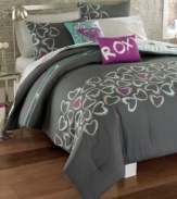 This Roxy Heart and Soul decorative pillow makes a statement with signature writing against a vibrant purple landscape.