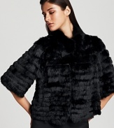 Endlessly luxe tiers of supple, soft kid fur trickle down Armani's cropped coat, an effortless cold-weather layer that instantly lends a dressed up look.