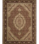 Distinctive flair with roots in Persian design. This exquisitely ornate area rug is abound in soft, satisfying brick tones, highlighted by a dramatic central medallion, and crafted from Nourison's own Opulon(tm) yarns for a densely woven pile with long-lasting color retention and durability.