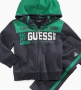 Keep him motivated to move in this comfortable hoodie and pant set from Guess.