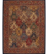 This rug features a floral motif in yarn-dyed blues, reds and golds for an intricate design of dramatic color. Handcrafted wool pile imparts an indulgent softness.