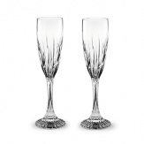 Beveled cuts of varying heights add grandeur to Baccarat's Juputer Champagne flutes.