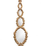 Gilded era. A very sculptural quartet of gilded laurel wreaths make up the frame of Altria mirror from Howard Elliott. And because of its vertical emphasis, it can work wonders for narrow wall spaces.