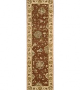 Bring new life to any room of your home. This gorgeous rug, sprouting intricate designs of vinery and blossoming flowers, opens up any space with warm tones of burnt red and beige. With an all-wool construction, accented with rich silk highlights, this stylish Nourison 2000 import is ultra-durable and luxuriously soft to the touch.