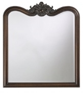 With a square base and curving top crowned in foliage, the bronze Eliza wall mirror provides a delightful balance of timeless simplicity and antique charm.