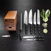 Designed exclusively by Matteo Thun, this gorgeous cutlery is precision forged from a single piece of ice-hardened stainless steel with a unique wedge-shaped blade that gives you optimum stability. The triple-riveted, full-tang handles have a dynamic design that fit neatly in your hand. Set includes: 4 paring/utility, 5 serrated utility, 6 slicing, 8 chef's, 9 sharpening steel, kitchen shears & wood block.