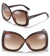 Exude elegance in oversized squared sunglasses with a criss-cross silhouette and gradient lenses.