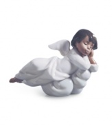 An angel from Lladro, the Heavenly Dreamer figurine watches over your family from a fluffy white cloud, in delicately handcrafted porcelain.