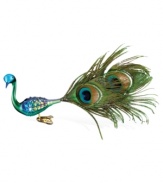 If you can't get away for the holidays, bring the tropics to you with this bejeweled feathers Christmas ornament by Inge-Glas. Mouth-blown and hand-painted, this colorful ornament adds character to any Christmas tree.