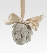 A glittery ornament for the discerning collector, carefully handcrafted in Tuscan artichoke-shaped glass glitter with a satiny ribbon loop. Ribbon loop Glass glitter 5H X 5 diam. Handmade in USA 
