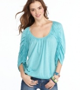 Drawstring sleeves and a blouson fit elevates this American Rag top to casually fantastic heights!  A worthy companion to jeggings and comfy flats!
