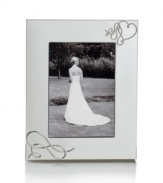 Show your romantic side. Loopy hearts in the silver-plated Love Story picture frame showcase special moments with elegant whimsy. From Mikasa.