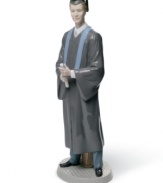 Celebrate your son's commencement with this porcelain figurine from Lladró. Clad in robe and mortarboard, diploma in-hand, this proud graduate represents the hardworking scholar in your life.