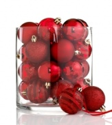 A favorite from one year to the next, Kurt Adler's shatterproof ball ornaments mix stripes and swirls of glitter with matte and shiny finishes, all in festive holiday red.