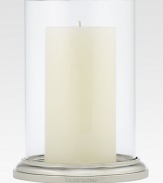 Gleaming glass and polished nickel is crafted to house a single pillar candle for a beautiful, ethereal effect. 8H X 5¾ diam.Glass and nickelImported