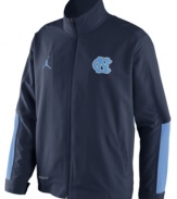 Get fired up! Keep the support of your favorite NCAA basketball team alive with this North Carolina Tar Heels jacket from Nike.