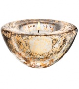 As good as gold, the Glimmer votive holder radiates holiday fun but dazzles all year long in heavy, shimmering glass. By Anna Ehrner for Kosta Boda.