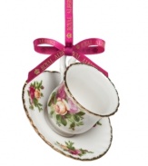 If you love it on your table, you'll adore it on the tree. This Old Country Roses ornament bears the classic pink and gold florals of Royal Albert's famed dinnerware collection in a mini teacup and saucer.