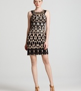 Enlivened by a graphic animal print, this Calvin Klein sheath dress injects your working wardrobe with exotic appeal. Tame the style with a classic cardigan for office chic.