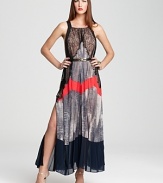 BCBGMAZARIA's trapeze-silhouetted gown lends a fashion-forward look with allover pleating, lace accents and a bright splash of contrasting color.