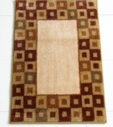 In plush cotton velour with a rich geometric motif, this decadently soft bath mat makes the canvas for very comfy feet.