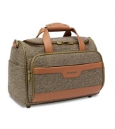 Lend your travels a look of distinction with Hartmann's handsome cosmetic tote. Outfitted in sophisticated tweed with rich, leather accents, you'll be able to organize your belongings for journeys both short and long. Lifetime warranty.